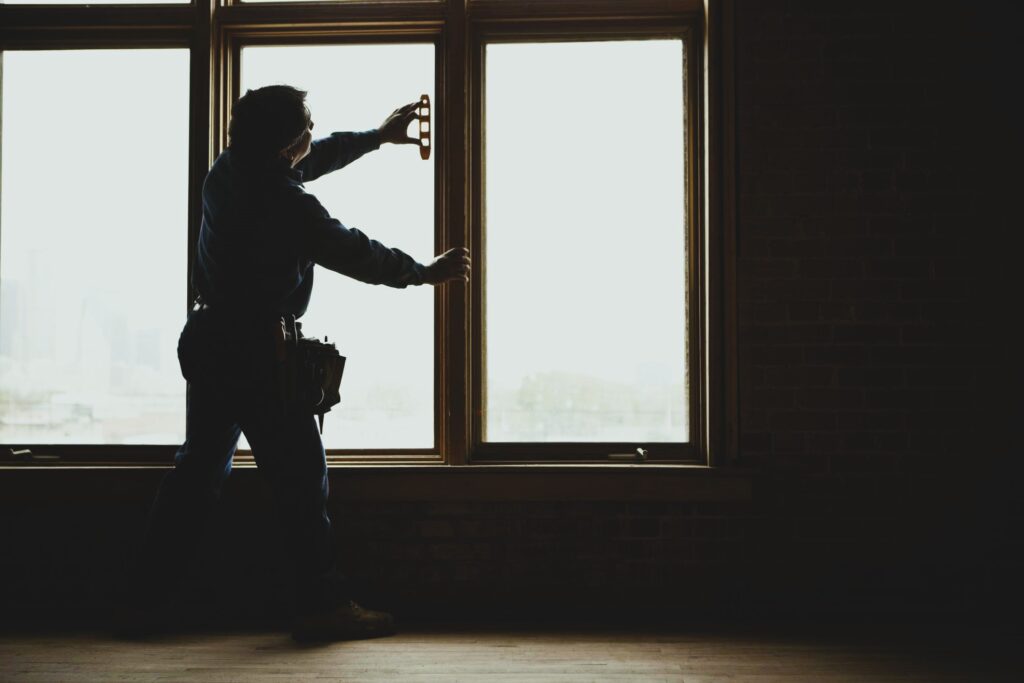 Man and Vinyl Window